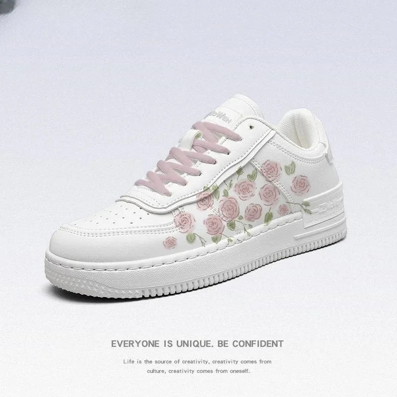 white sneaker with pink rose floral print and light pink laces on a white background