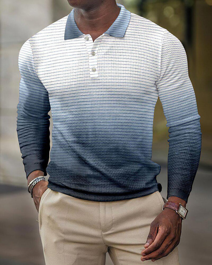 Man wearing blue gradient striped long-sleeve polo shirt with beige pants and wristwatch