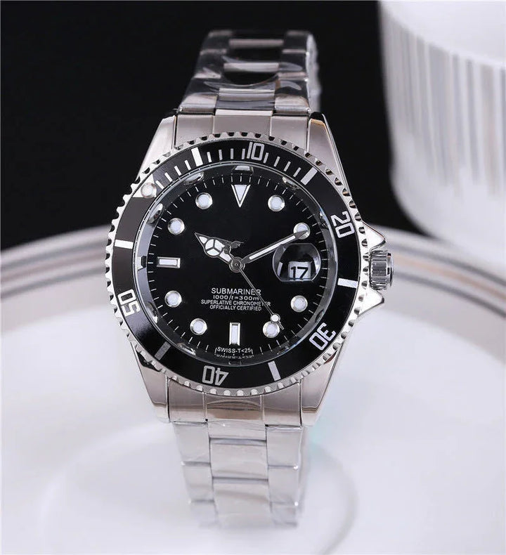 Silver Submariner wristwatch with black dial, luminous markers, date window, and metal bracelet