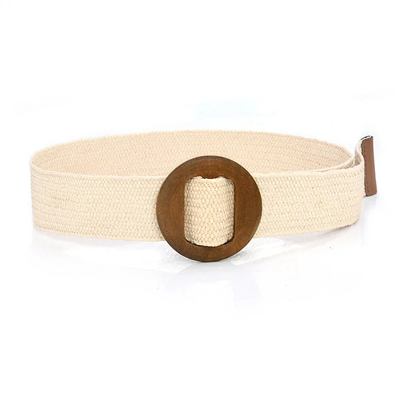 Beige woven fabric belt with a round wooden buckle on a white background