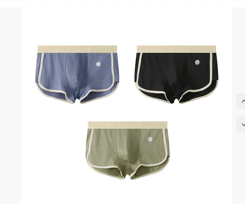 Set of three ribbed boxer briefs in blue, black, and olive green with beige waistband and trim