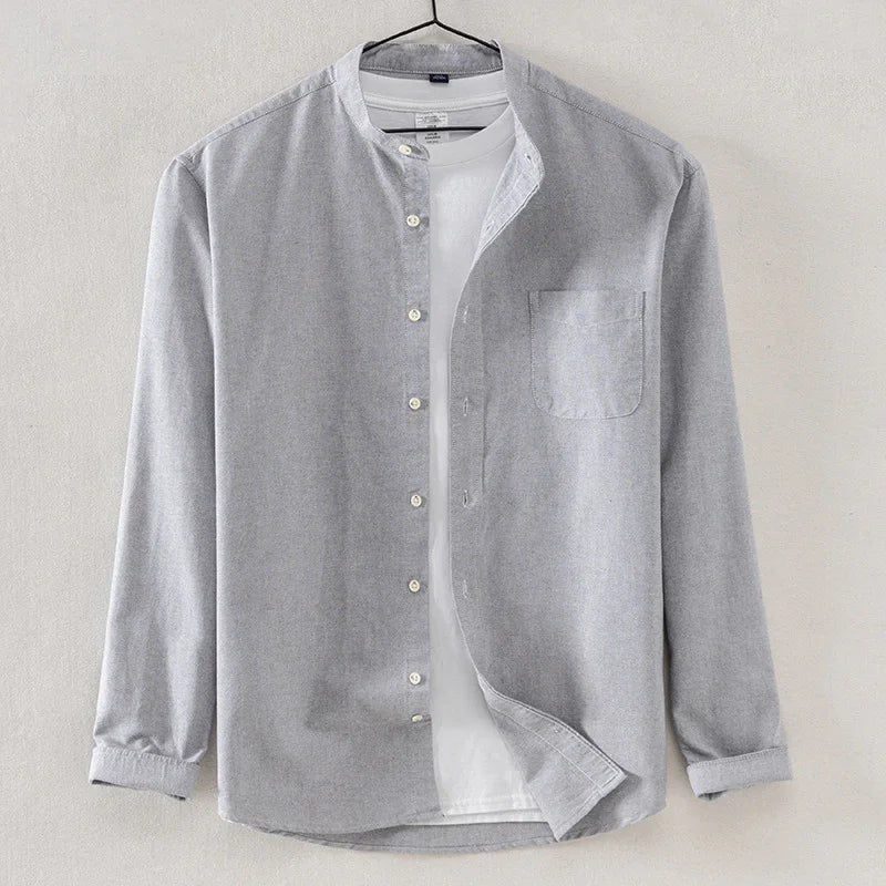 Light grey mandarin collar shirt layered over a white crew neck t-shirt on hanger