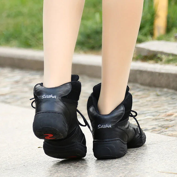 Black Sasha brand dance shoes worn on street with visible beige tights