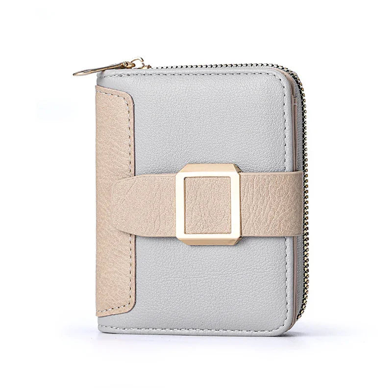 Compact gray and beige leather wallet with gold buckle and zipper closure