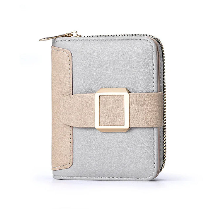 Compact gray and beige leather wallet with gold buckle and zipper closure