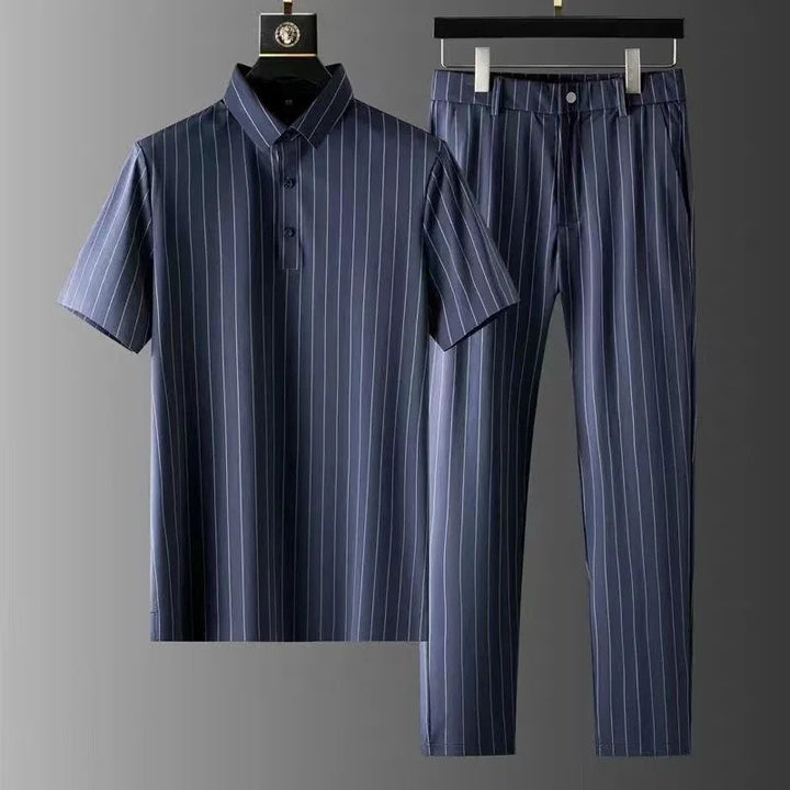 Navy blue pinstripe short-sleeve polo shirt and matching trousers set on hangers