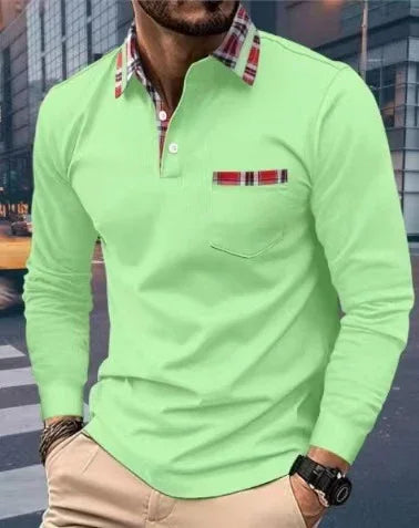 Man wearing light green long sleeve polo shirt with plaid collar and chest pocket detail in urban street setting