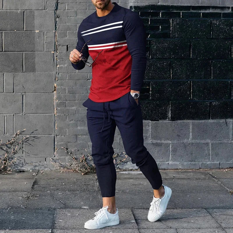man in navy and red long-sleeve shirt with white stripes, navy joggers, white sneakers, street style outfit