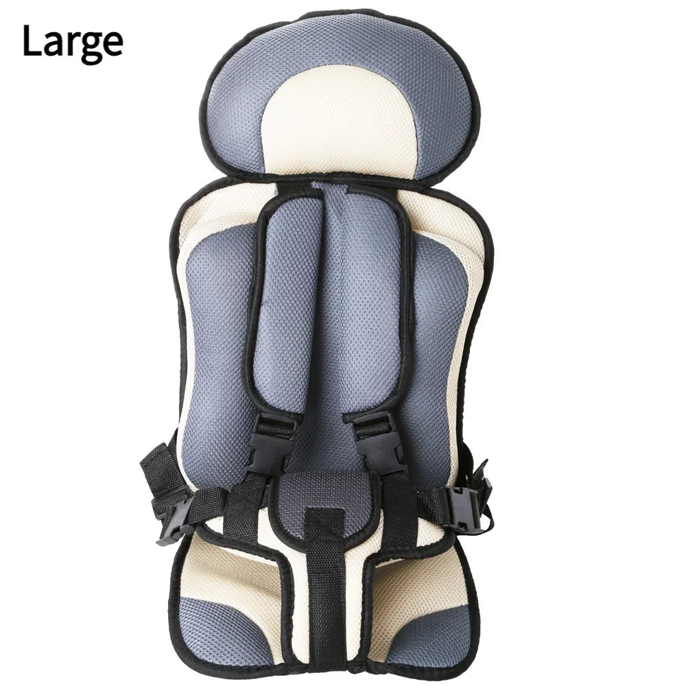 Large gray and beige padded child safety car seat with black harness straps