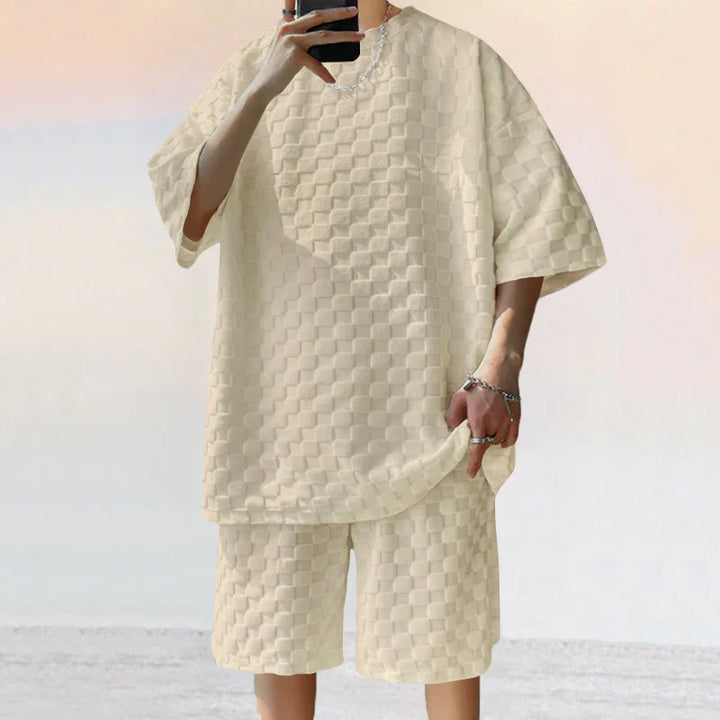 Person wearing beige checkered textured oversized t-shirt and matching shorts set