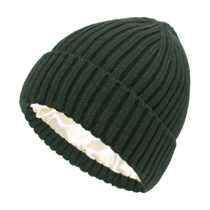 Dark green ribbed knit beanie hat with white satin lining inside