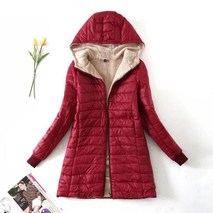 Red quilted hooded winter jacket with beige fleece lining on white background