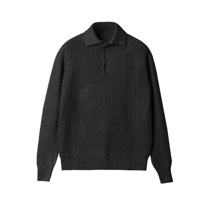 black cable knit sweater with collar and button placket on white background