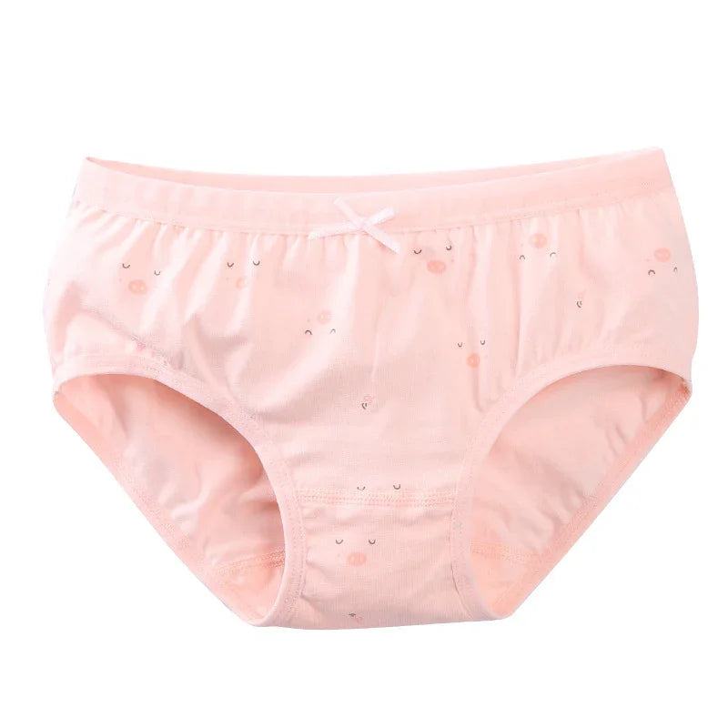 Light pink women's cotton underwear with small cute face prints and a bow detail