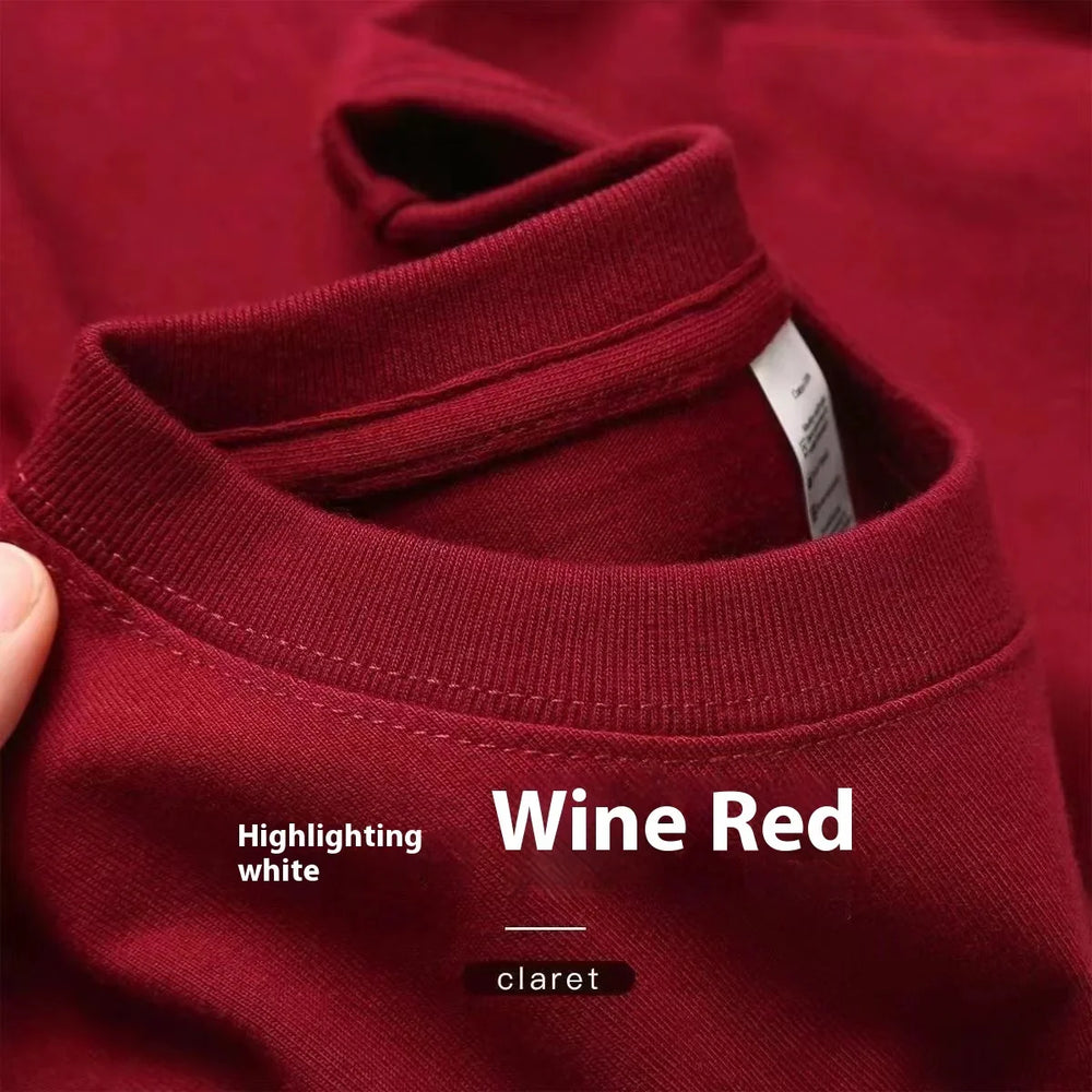 Close-up of a wine red claret t-shirt collar with visible stitching and fabric texture