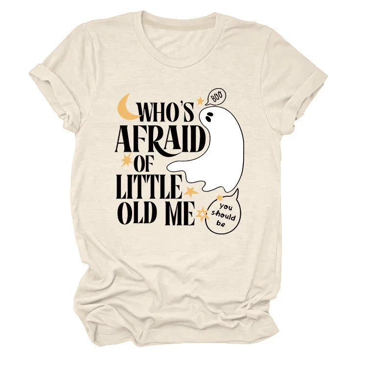Beige t-shirt with black text 'Who's Afraid of Little Old Me' and cartoon ghost saying 'Boo' and 'you should be'