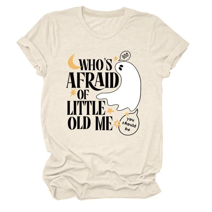 Beige t-shirt with black text 'Who's Afraid of Little Old Me' and cartoon ghost saying 'Boo' and 'you should be'