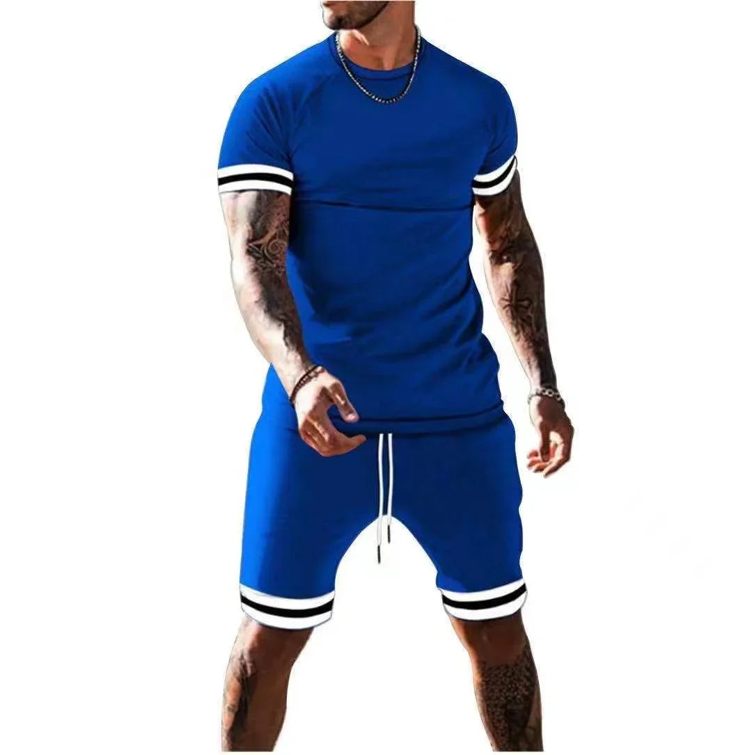 Man wearing blue athletic t-shirt and shorts with white and black striped cuffs, casual sportswear
