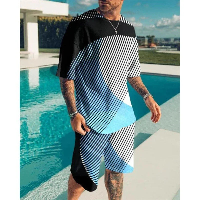 man wearing black and blue geometric striped matching t-shirt and shorts standing by outdoor pool