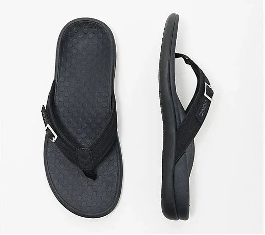 Black Ionic brand thong sandals with textured footbed and adjustable straps on white background