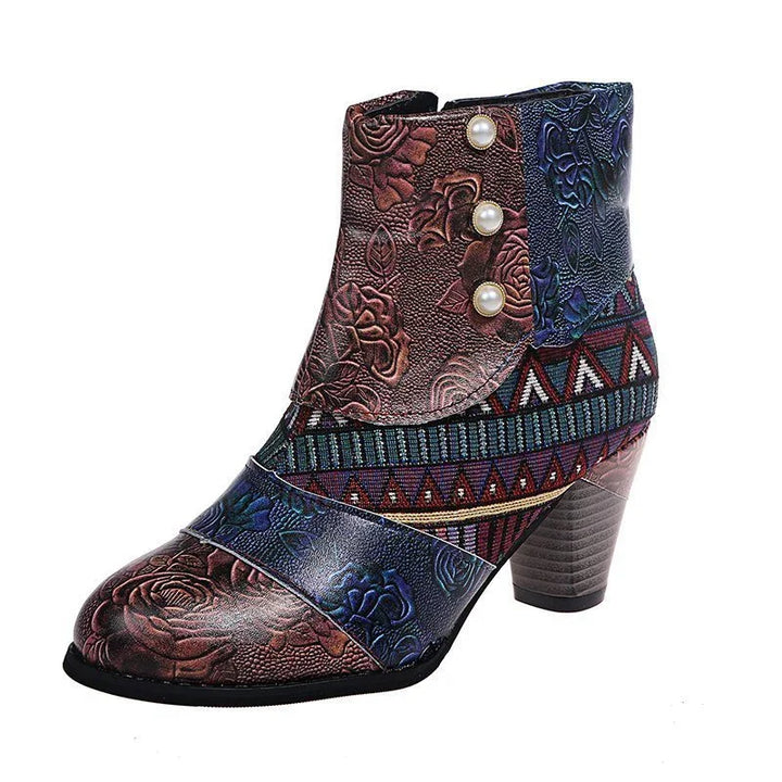 Women's ankle boot with embossed floral leather, decorative pearl buttons, and geometric fabric accents