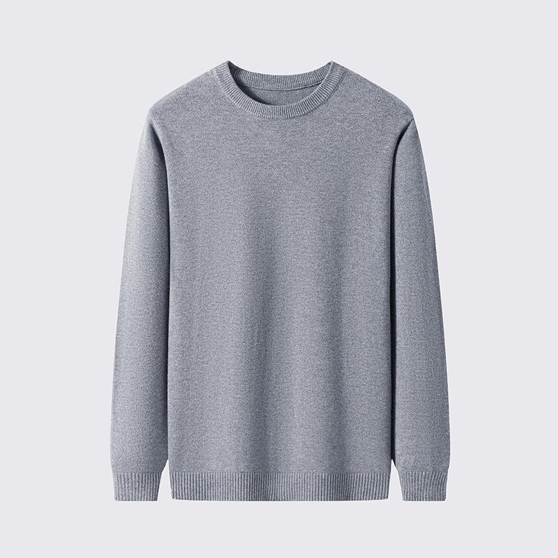 Simple grey crewneck sweater with long sleeves, ribbed cuffs and hem, plain background