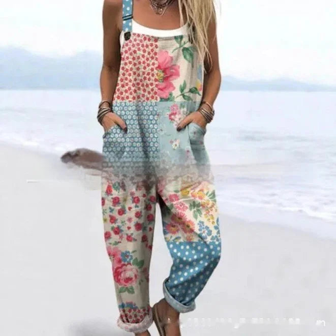 woman wearing colorful floral patchwork overalls with pockets on a beach
