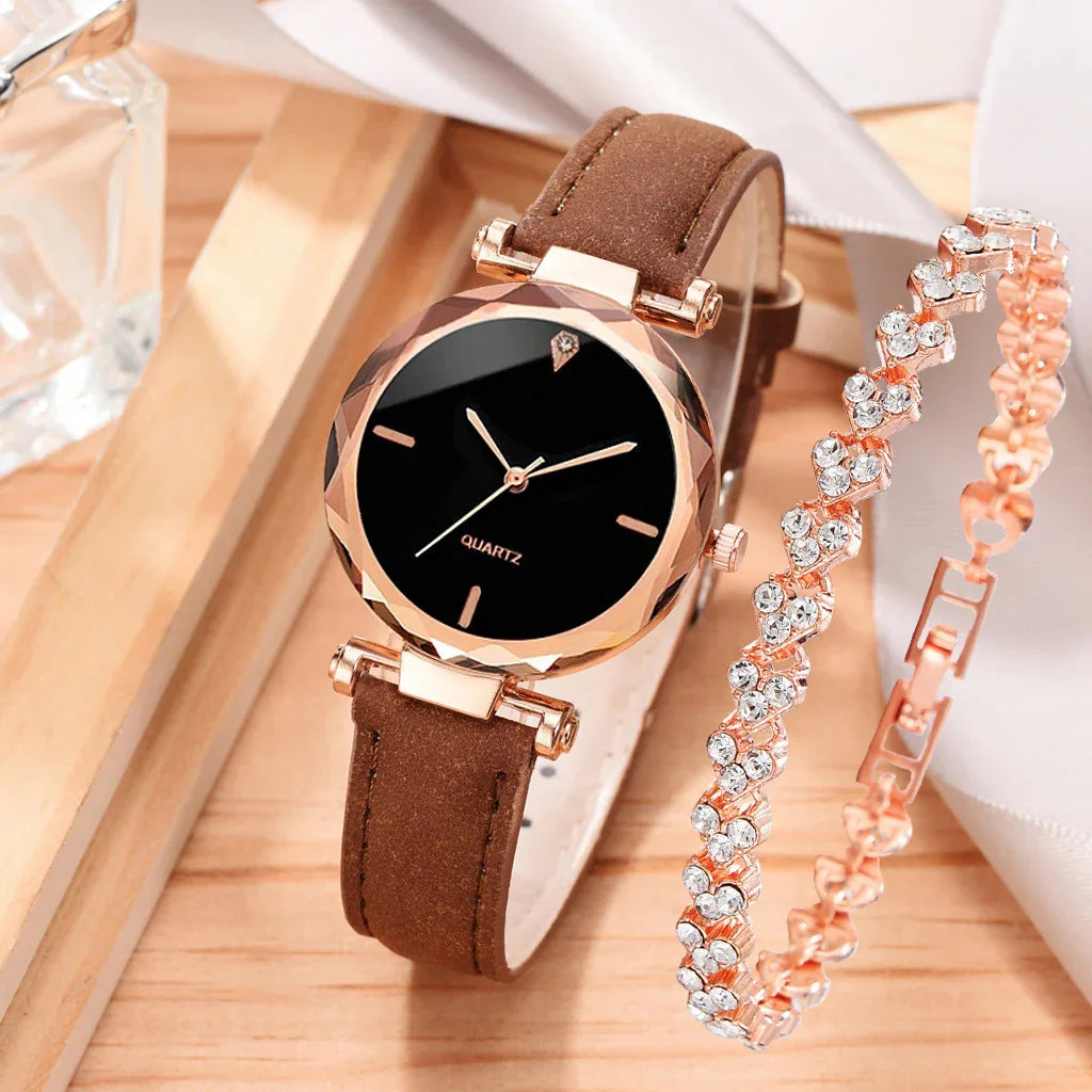 Elegant quartz wristwatch with brown leather strap and rose gold crystal bracelet on wooden tray