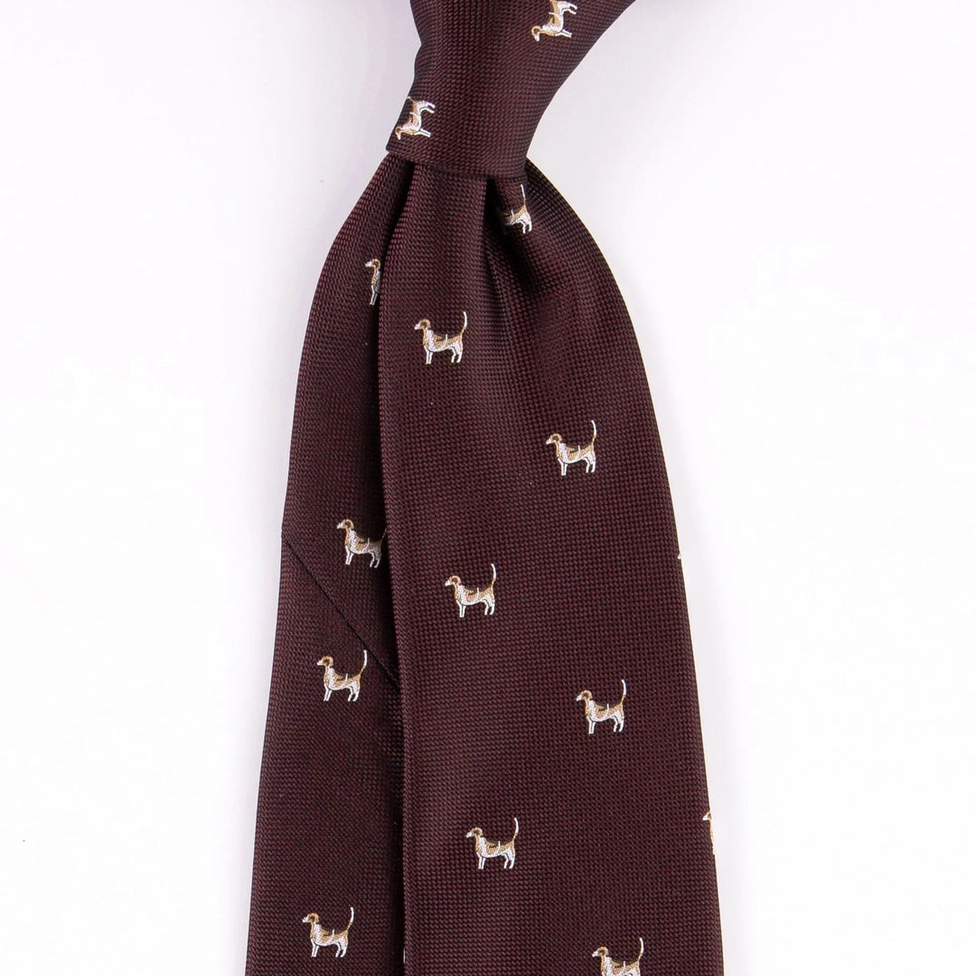Brown textured necktie with small embroidered dog pattern on white background