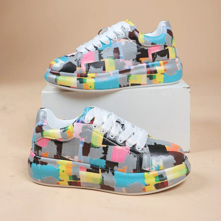 Colorful abstract pattern casual sneakers with white laces displayed on white box