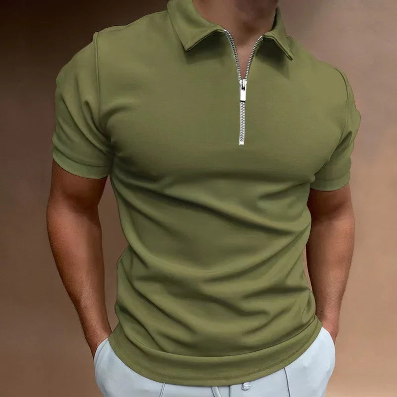 Man wearing olive green short-sleeve polo shirt with front zipper and light gray pants
