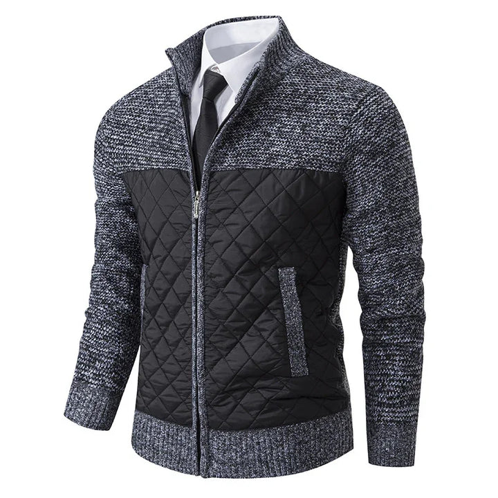Men's grey and black quilted knit zip-up jacket with collar, worn over white shirt and black tie