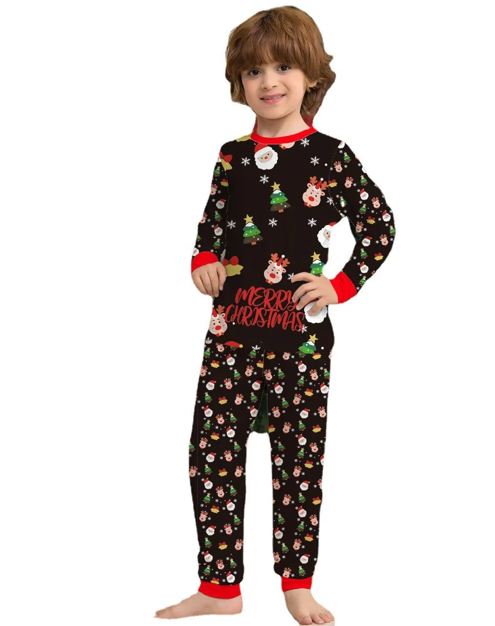 Child wearing black Christmas pajamas with Santa, reindeer, trees, and Merry Christmas text