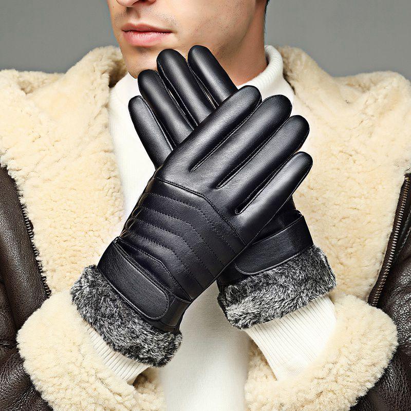 Man wearing black leather gloves with fur cuffs and a shearling jacket