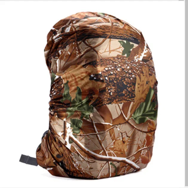 Camouflage backpack cover with forest leaf and branch pattern on white background