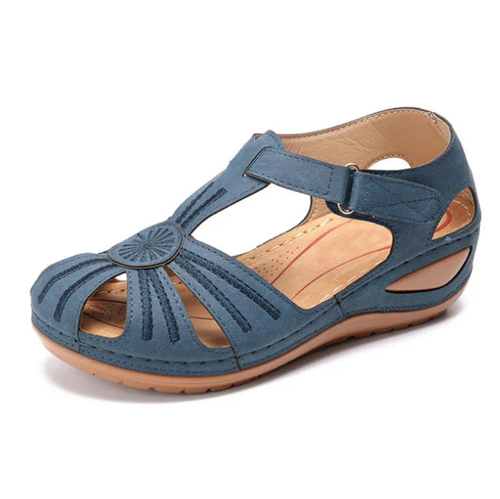 Blue women's casual closed-toe sandal with adjustable strap and cushioned sole