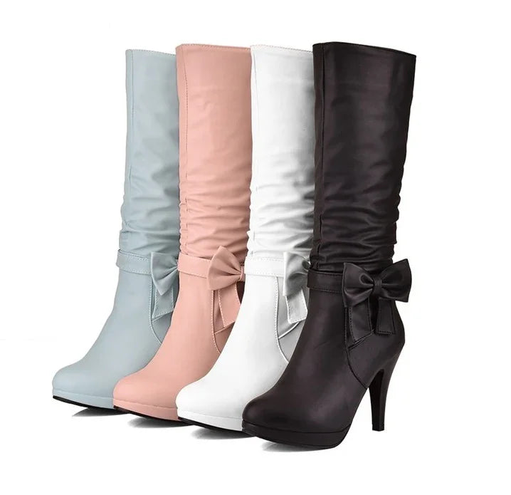 High heel knee-high women's boots in light blue, pink, white, and black with side bows