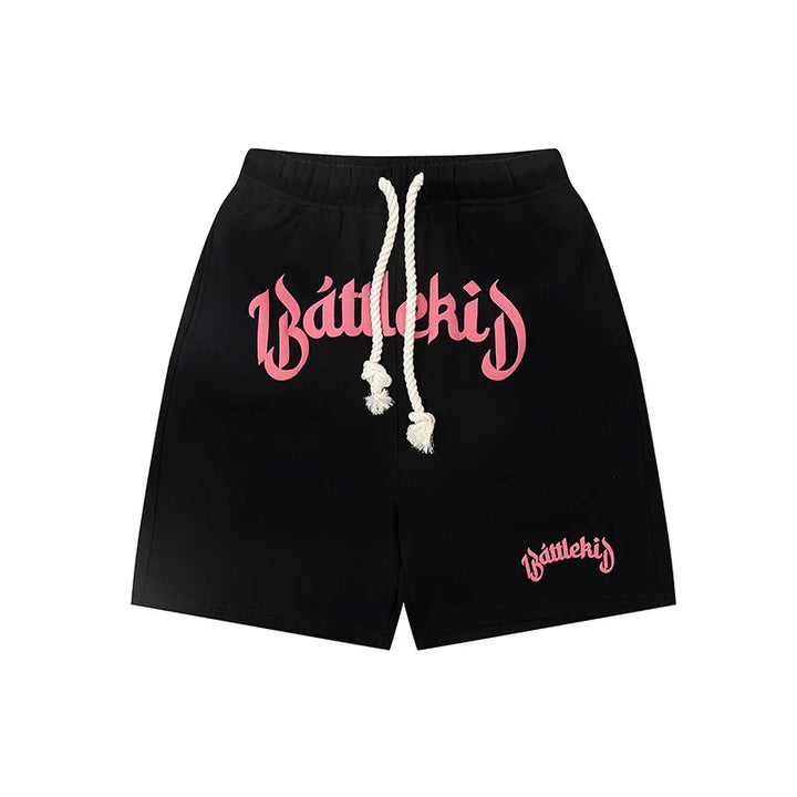 Black Battlekid shorts with pink logo and white drawstring on white background