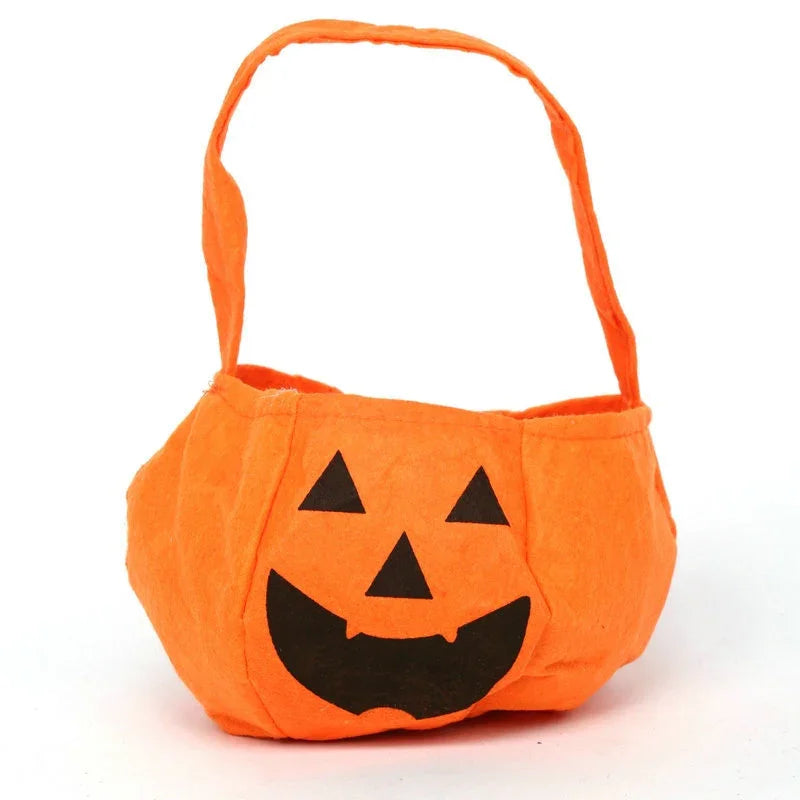 Orange Halloween pumpkin fabric bucket with a smiling jack-o'-lantern face and handle
