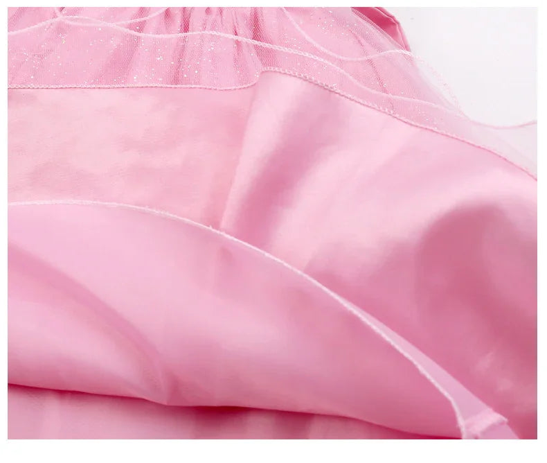 Close-up of pink fabric layers with sheer glittery tulle overlay