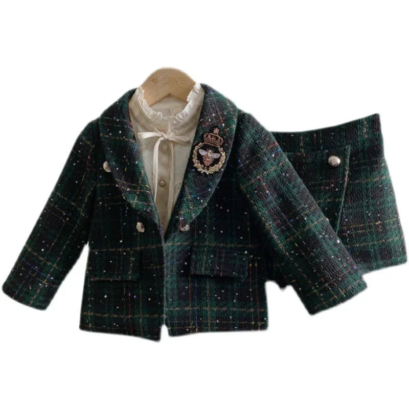 Children's dark green plaid tweed jacket with a white embroidered bee patch and matching skirt