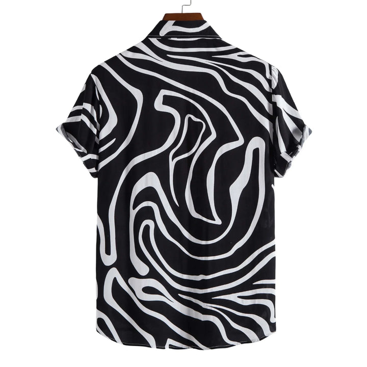 Black and white short sleeve shirt with abstract swirl pattern hanging on wooden hanger
