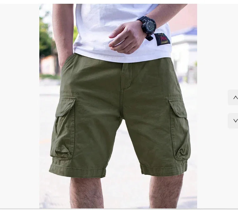man wearing olive green cargo shorts with side pockets and white t-shirt outdoors