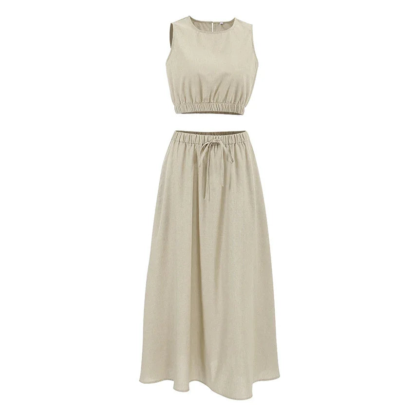 Beige sleeveless crop top and high-waist drawstring maxi skirt set on white background