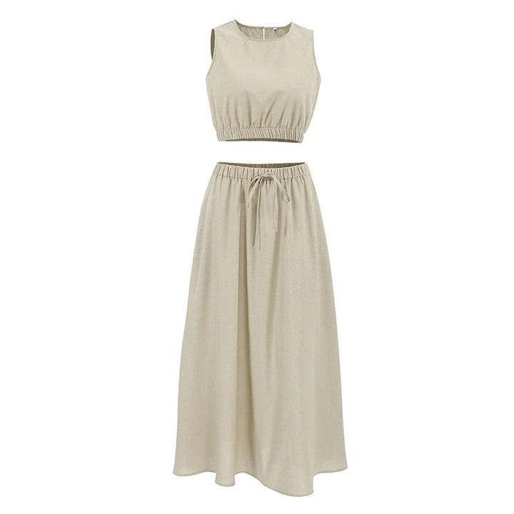 Beige sleeveless crop top and high-waist drawstring maxi skirt set on white background