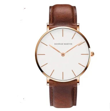 Hannah Martin minimalist wristwatch with white dial, rose gold case, and brown leather strap