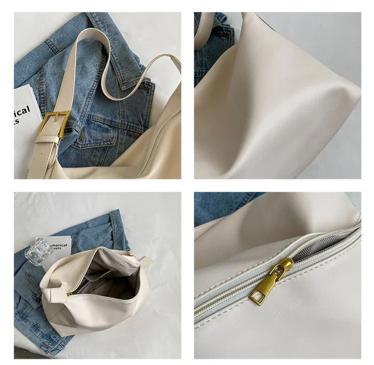 Beige leather handbag with gold buckle and zipper details, styled on denim jacket background