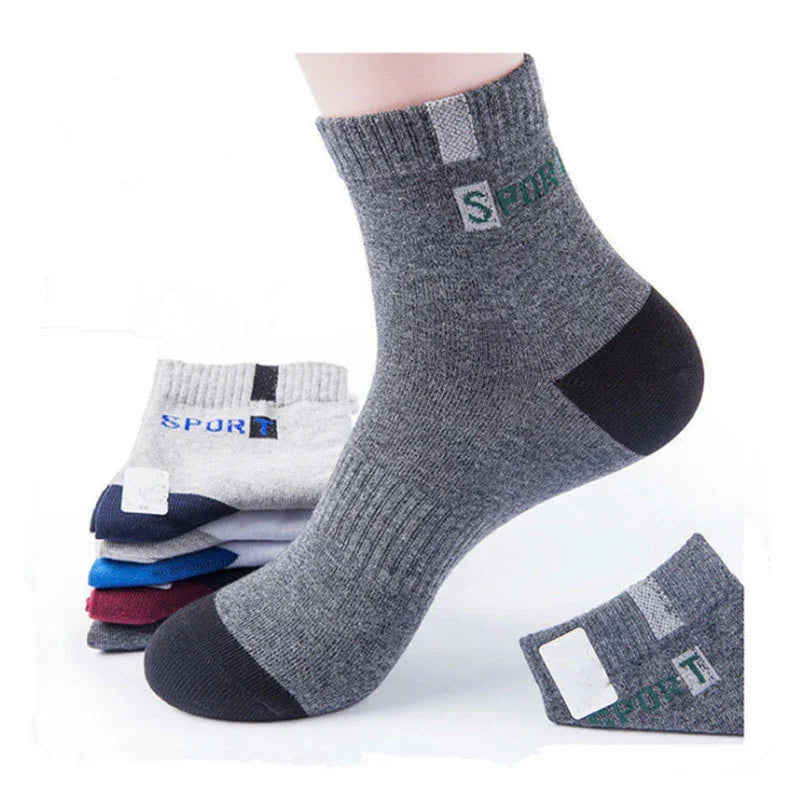 Grey sport ankle socks with black heel and toe, featuring ribbed cuff and text on side
