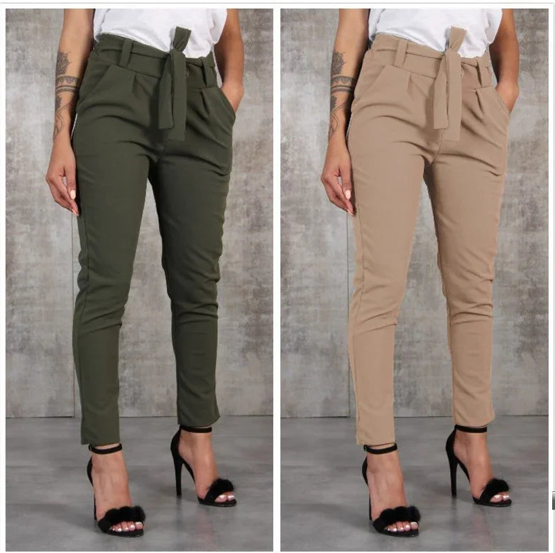 Women wearing high-waisted paperbag pants with belt in olive green and beige paired with black high heel sandals