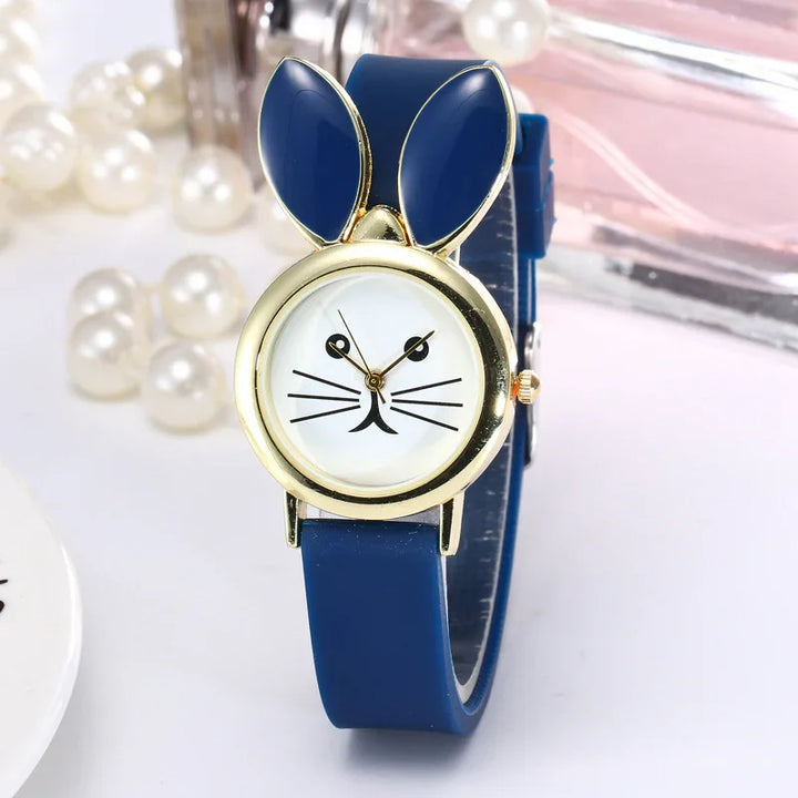 Blue silicone wristwatch with gold bunny ears and a rabbit face dial design